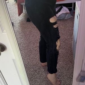 Tight black ripped jeans